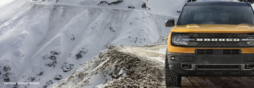yellow bronco sport on mountain