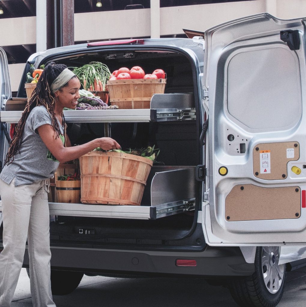Farmer Loading a Ford Transit with Crops