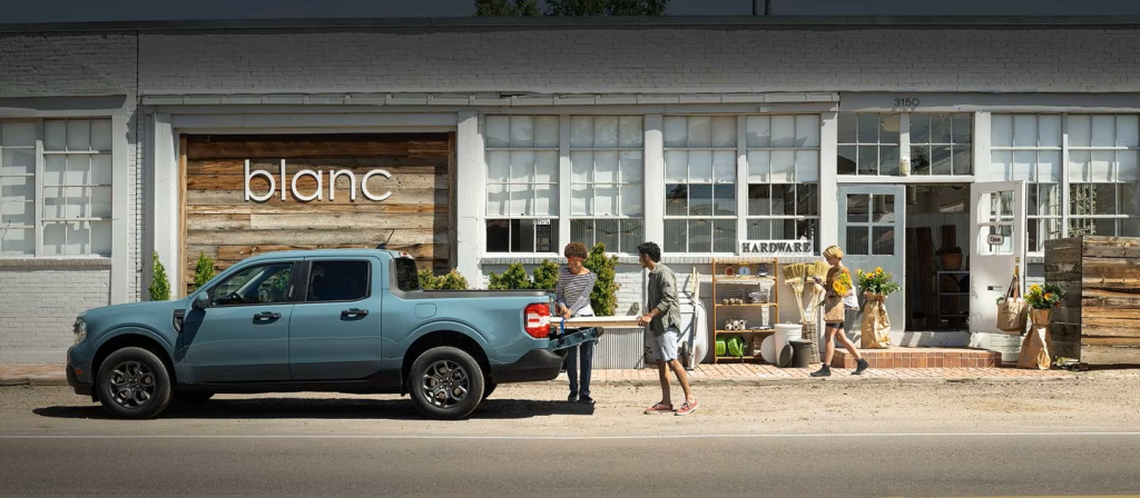 College Students Loading Up a Ford Maverick