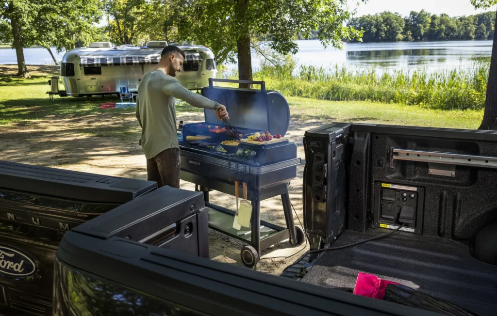 Man Grilling Using his Ford F150 as a Power Source