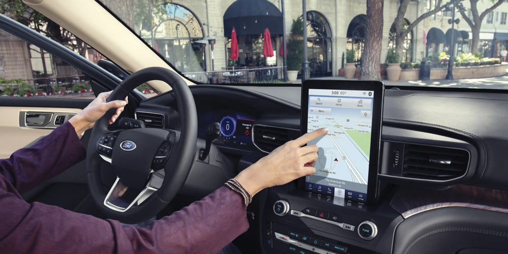 Driver Using Ford Explorer Infotainment System