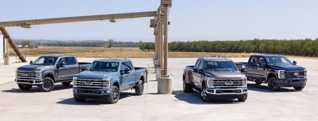 Four Ford F Series' Parked in a Field