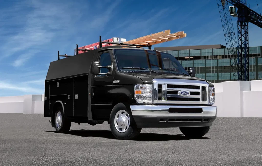 Ford Commercial Chassis with Customized Box Parked Front 3/4 View on Top of a City Parking Deck