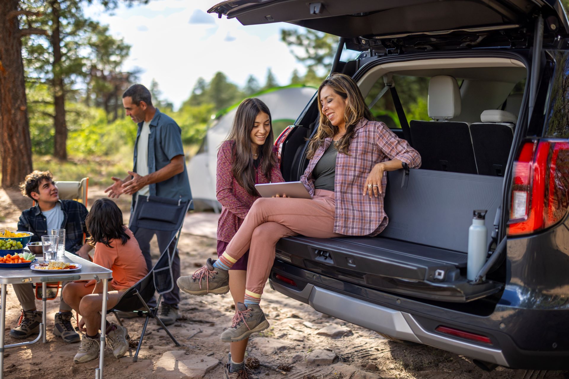 A Family Enjoying Their 2025 Ford Expedition While Camping