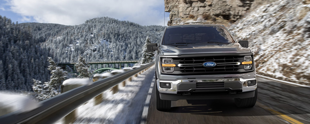 Ford F-150 driving on the highway in the winter