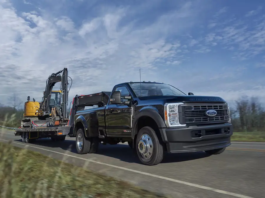 2025 Ford Super Duty Truck Towing an Excavator