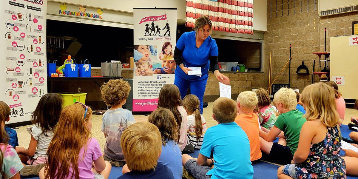 Kids receiving education on dental health from a Just Kids Dental Hygenist and Instructor