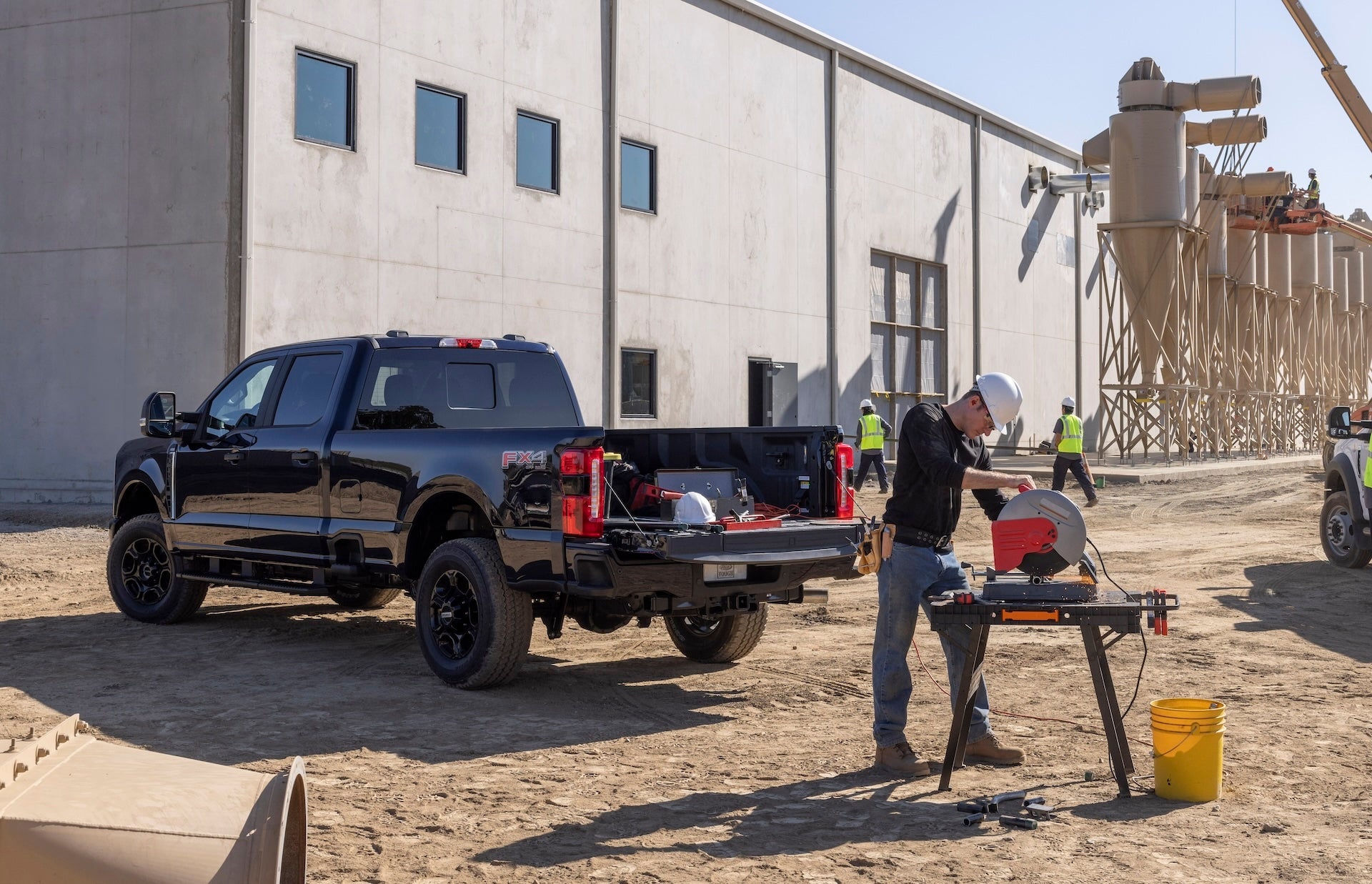 Construction Worker Working with Tools He had in the back of his Ford 4x4 Pickup Truck